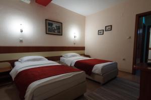 Voodi või voodid majutusasutuse Hotel Ilinden toas