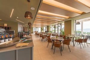 Reštaurácia alebo iné gastronomické zariadenie v ubytovaní Hapimag Resort Porto Heli