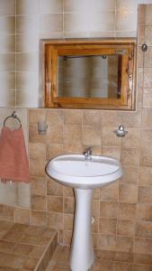 a bathroom with a white sink and a mirror at Villa Climate Guest House in Varna City +77 photos
