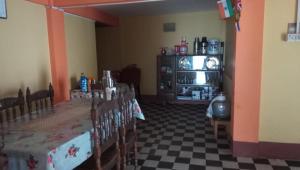 a dining room with a table and some chairs at Vamoose Norlha in Takdāh
