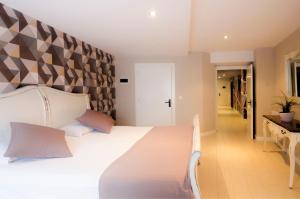 Postel nebo postele na pokoji v ubytování Hotel Arha Potes & Spa