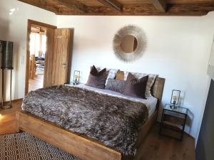 Krevet ili kreveti u jedinici u okviru objekta CHALET BELLE KAISER by Belle Stay