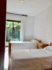 Posteľ alebo postele v izbe v ubytovaní APARTAMENTO - WIFI FREE - FRENTE AL MAR