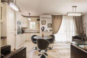 a kitchen with a table and chairs in a room at Beach House - healthy, protected location! El Campello, Alicante Spain in El Campello