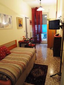 TV a/nebo společenská místnost v ubytování B&B Villa Olmo
