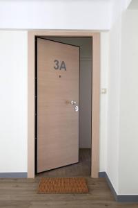 an elevator door with the number on it at MADONAS HOUSE PSIRI in Athens