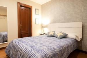 Ένα ή περισσότερα κρεβάτια σε δωμάτιο στο Atuaire Home Gran Vivienda en Centro Histórico San Lorenzo