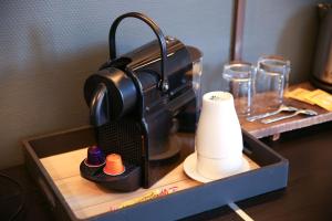 Příslušenství pro přípravu čaje a kávy v ubytování StandingAppart Marmande Centre