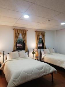 Postel nebo postele na pokoji v ubytování Quinta Spa El Rosal