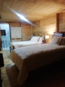 Postel nebo postele na pokoji v ubytování Quinta Spa El Rosal