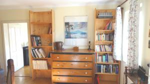 a room with a dresser and bookshelves at Marta's House in Bled