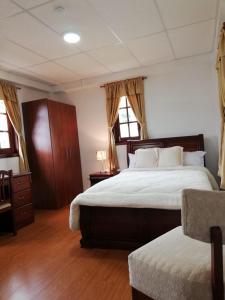 Postel nebo postele na pokoji v ubytování Quinta Spa El Rosal