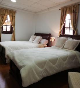 Postel nebo postele na pokoji v ubytování Quinta Spa El Rosal