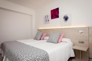 Postel nebo postele na pokoji v ubytování Hotel Timor