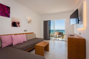 TV a/nebo společenská místnost v ubytování Hotel Timor