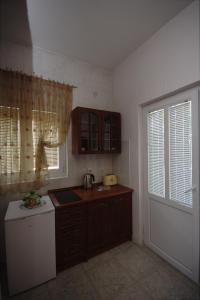 Kuchyň nebo kuchyňský kout v ubytování Apartments Astel