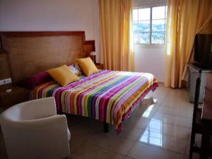 מיטה או מיטות בחדר ב-terrazas del duque B1313