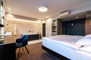 Säng eller sängar i ett rum på Hotel Karpatia