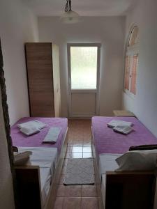 Postel nebo postele na pokoji v ubytování Apartments Astel