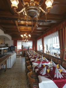 a long row of tables in a restaurant at Gasthof Gemse in Prutz