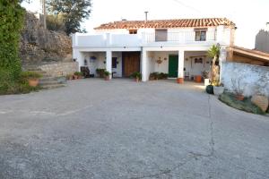 a house with a large driveway in front of it at Casa Rural en el campo - Mas de Tenesa in Benasal