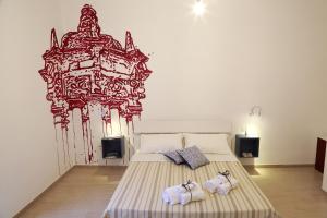 Postel nebo postele na pokoji v ubytování B&B EVO Nardò