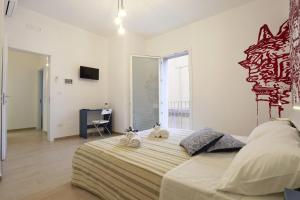 Postel nebo postele na pokoji v ubytování B&B EVO Nardò