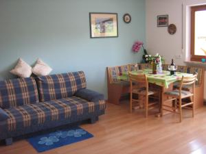 a living room with a couch and a table at Pitterle Hof in Meltina