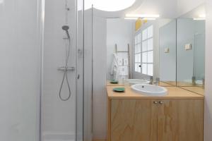 a bathroom with a sink and a shower at B28 Apartments Porto in Porto +111 photos