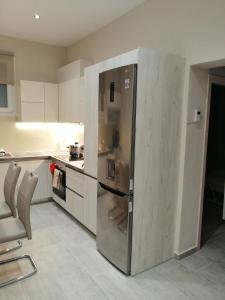 Kuchyň nebo kuchyňský kout v ubytování Olive Grove Deluxe apartment