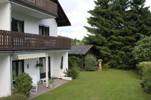 a view of a house with a yard at Haus Wanderlust in Willingen