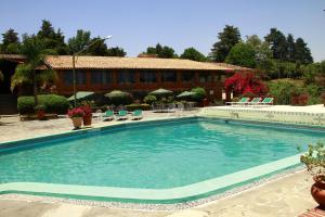 Bazén v ubytování Hotel Pie de la Sierra nebo v jeho okolí