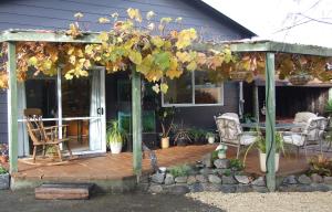 a pergola on a porch of a house at Wellesbourne Homestay B&B in Palmerston North