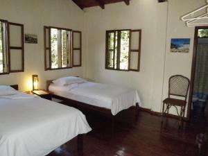 Ein Bett oder Betten in einem Zimmer der Unterkunft Jungle Lodge El Jardin Aleman