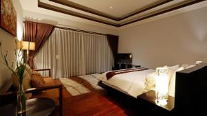 En eller flere senge i et værelse på Villa 58 Tanah Lot + 39 billeder