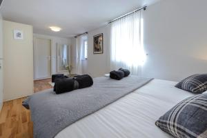 Posteľ alebo postele v izbe v ubytovaní Rooms Andro