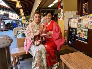two women sitting on a bench in a store at Ys Bed & Kitchen Tokyo #HY1 in Tokyo +44 photos