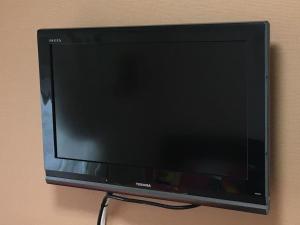 a flat screen tv sitting on a wall at Ys Bed & Kitchen Tokyo #HY1 in Tokyo