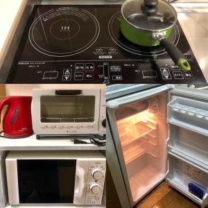 a kitchen with a stove top oven and a microwave at Ys Bed & Kitchen Tokyo #HY1 in Tokyo