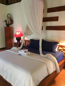 Postel nebo postele na pokoji v ubytování Lullaby Bungalows
