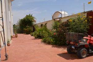 a small vehicle parked outside of a building at villa térangart saly in Saly Portudal