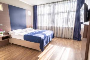 Postel nebo postele na pokoji v ubytování Hotel Orangerie