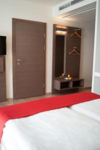 Postel nebo postele na pokoji v ubytování Hotel Orangerie