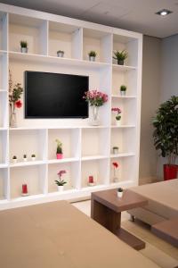 TV a/nebo společenská místnost v ubytování Hotel Orangerie