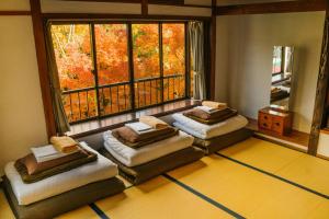 Postel nebo postele na pokoji v ubytování Onsen Guesthouse HAKONE TENT
