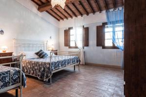 Postel nebo postele na pokoji v ubytování Antonella House -Podere della Collina