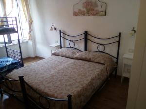 a bedroom with a bed in a room at b&b ilfenicottero in Orbetello