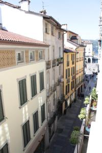 an alley in an old town with buildings at Perfect apartment Como in Como