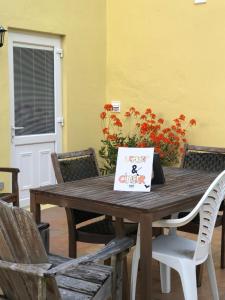 a wooden table with a happy birthday bag on it at Lemon and Ginger in Pembroke