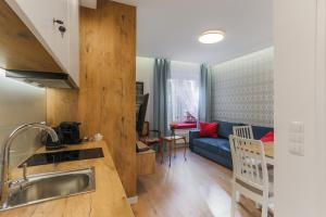 Kuchyňa alebo kuchynka v ubytovaní Central Apartments Piwna